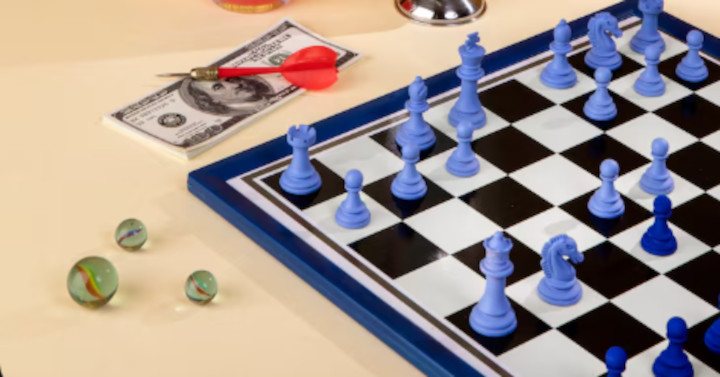 Checkerboard with blue chess pieces arranged with some other things
